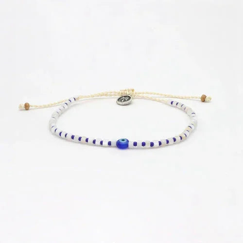 Blue and white beaded anklet with adjustable cord and central evil eye charm