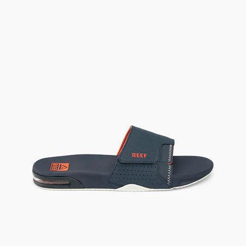 Reef Fanning slide sandal navy with orange and white details, visible air-cushioned sole