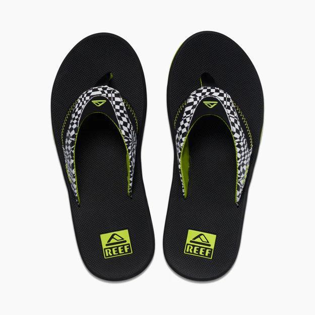 Reef Fanning men's black flip flops with checkered straps and yellow logo, top view