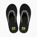 Reef Fanning men's black flip flops with checkered straps and yellow logo, top view