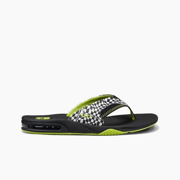 Reef Fanning black and neon green flip flop with checkered strap for watersports