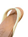 Reef women's pale banana flip flop with cushioned sole and textured white strap