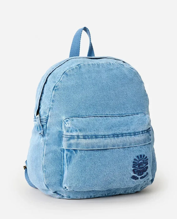 Rip Curl distressed light blue denim backpack with front pocket and logo, surf clothing accessory.