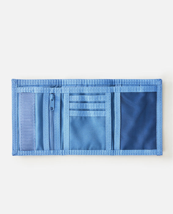 Rip Curl blue distressed denim wallet with multiple compartments and zipper pocket