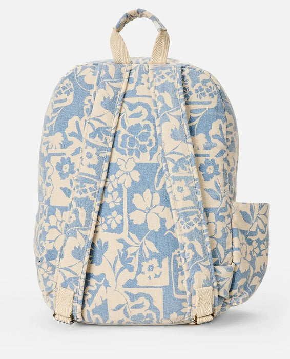Rip Curl mixed canvas backpack with blue and cream floral print, adjustable straps