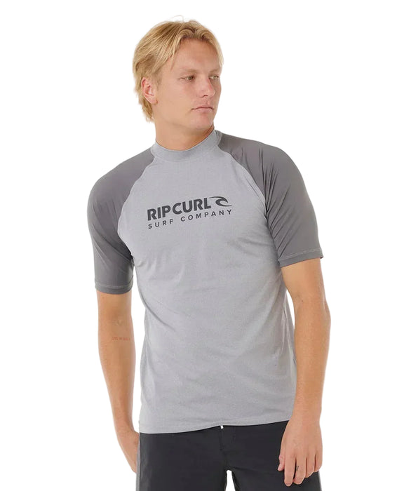 Rip Curl short sleeve grey rash vest for watersports with UPF50, worn by male model