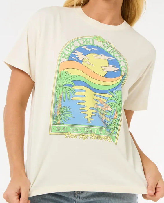 Rip Curl Sun and Sea relaxed tee, off-white, with colorful surf graphic and palm trees.