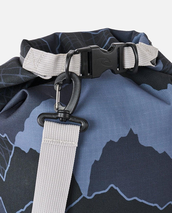 Rip Curl grey dry bag with clip closure and adjustable strap, close-up of waterproof material