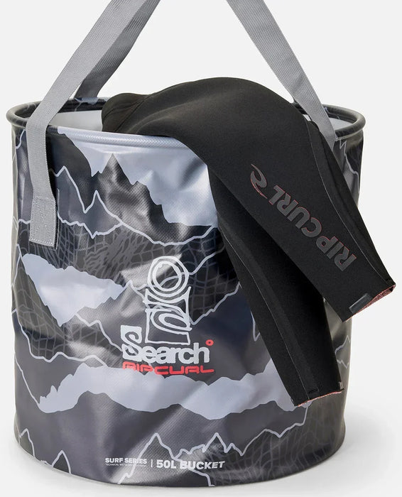 Rip Curl Surf Series 50L grey wetsuit bucket with black wetsuit draped over edge