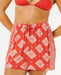 Red Rip Curl Ventura women’s board shorts with white floral print and drawstring waist