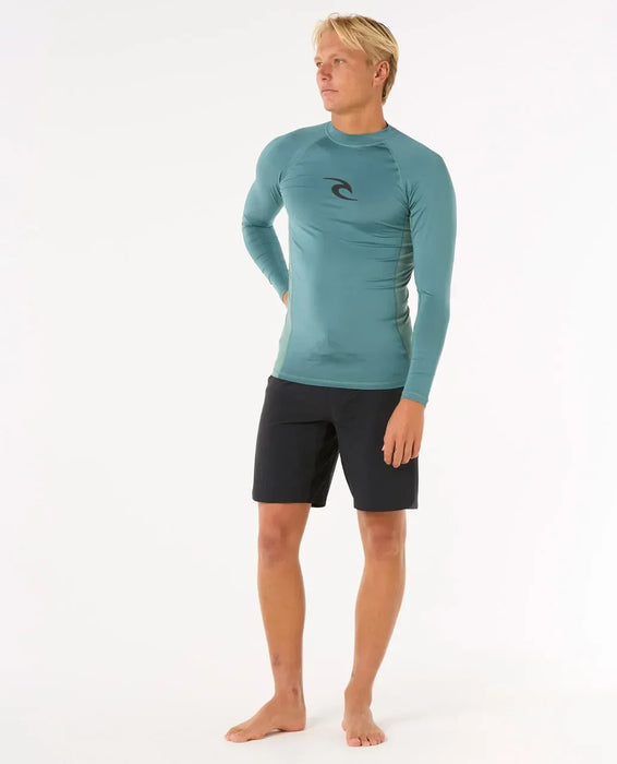 Rip Curl long sleeve blue rash vest for men, UPF surf swim shirt, worn with black shorts