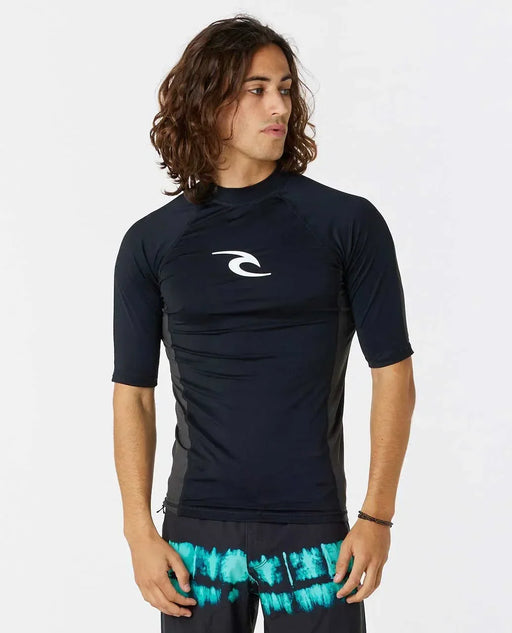 Rip Curl black short sleeve surf rash vest with white logo, worn by male model