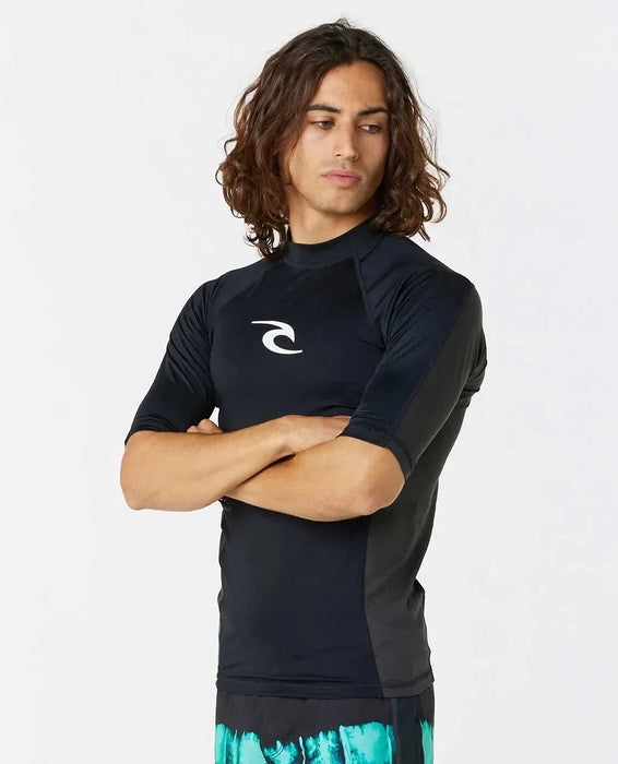Rip Curl black short sleeve rash vest for watersports, UPF, worn by male model