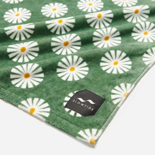 Slowtide green towel with white daisy pattern, ideal for watersports and beach use