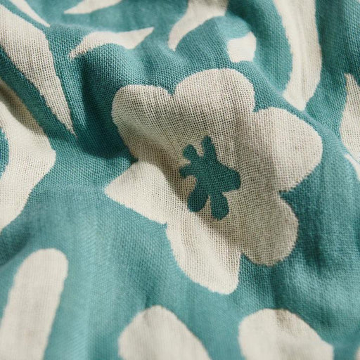 Teal and white floral patterned beachwear fabric