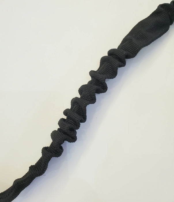 Black windsurfing sail uphaul rope with textured design on white background