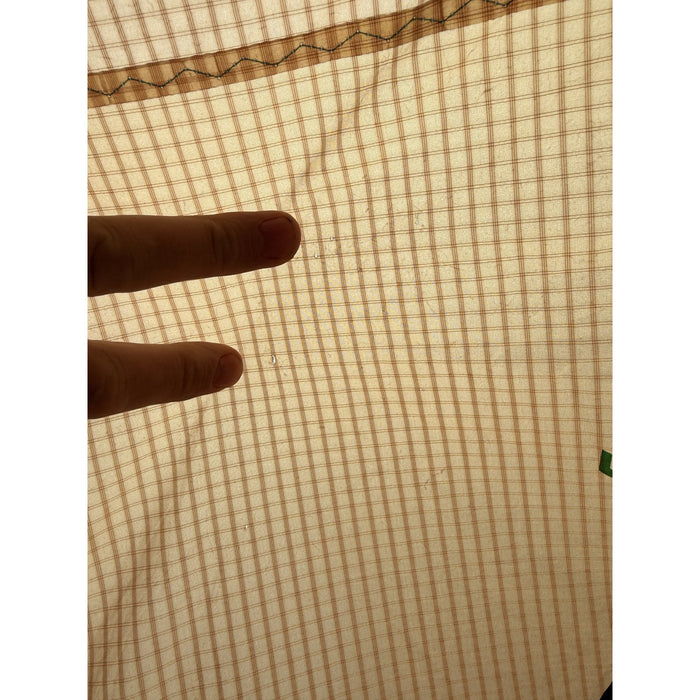 Close-up of a tiny repaired pin-prick on the Duotone Neo SLS canopy
