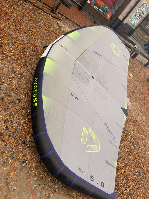 Full view of the used Duotone Unit 6m wing showing its white and grey canopy
