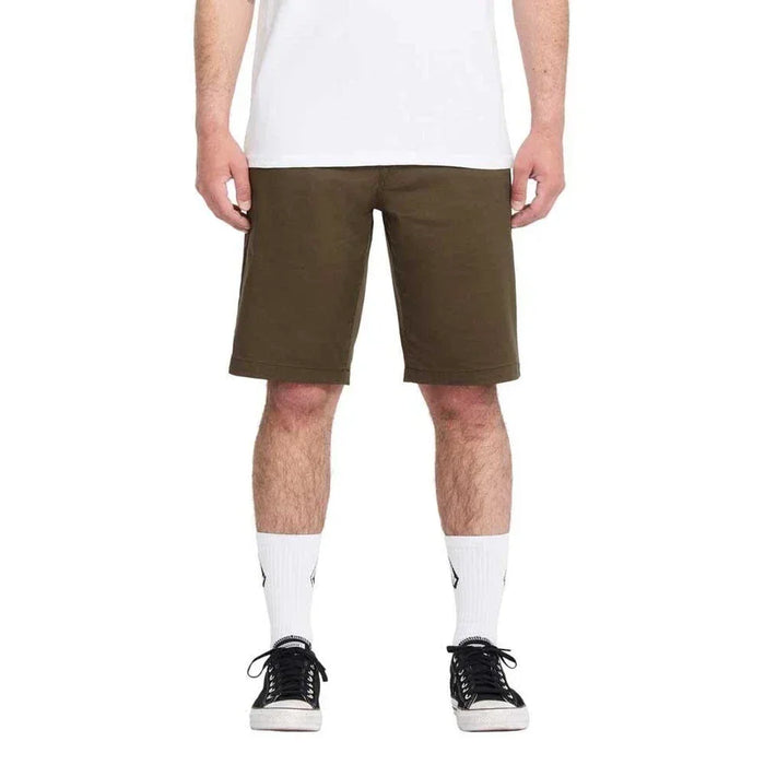 Volcom Sage Fleece Shorts olive green, worn by male model, casual knee-length style