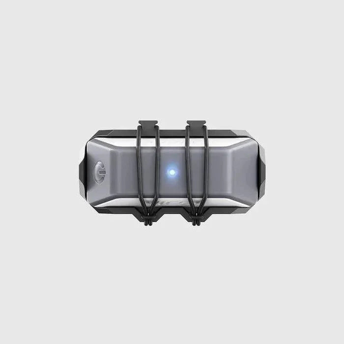 WOO 4.0 kiteboard sensor with blue LED, grey casing, and black mounting straps